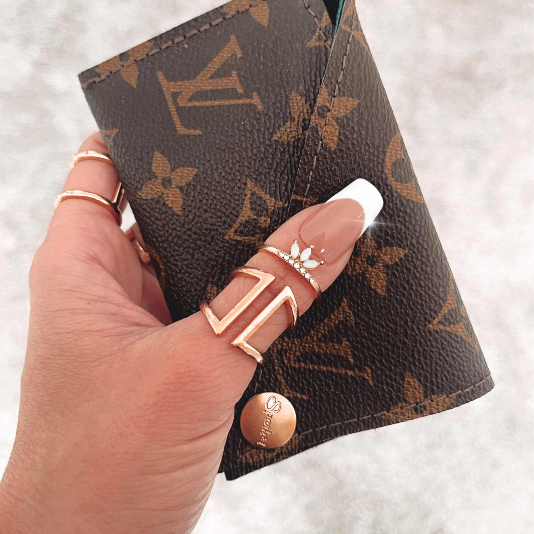 Reusable, handmade press on nails in a beautiful standard french design with a soft nude base. shown in extra short coffin by hannalee marie.