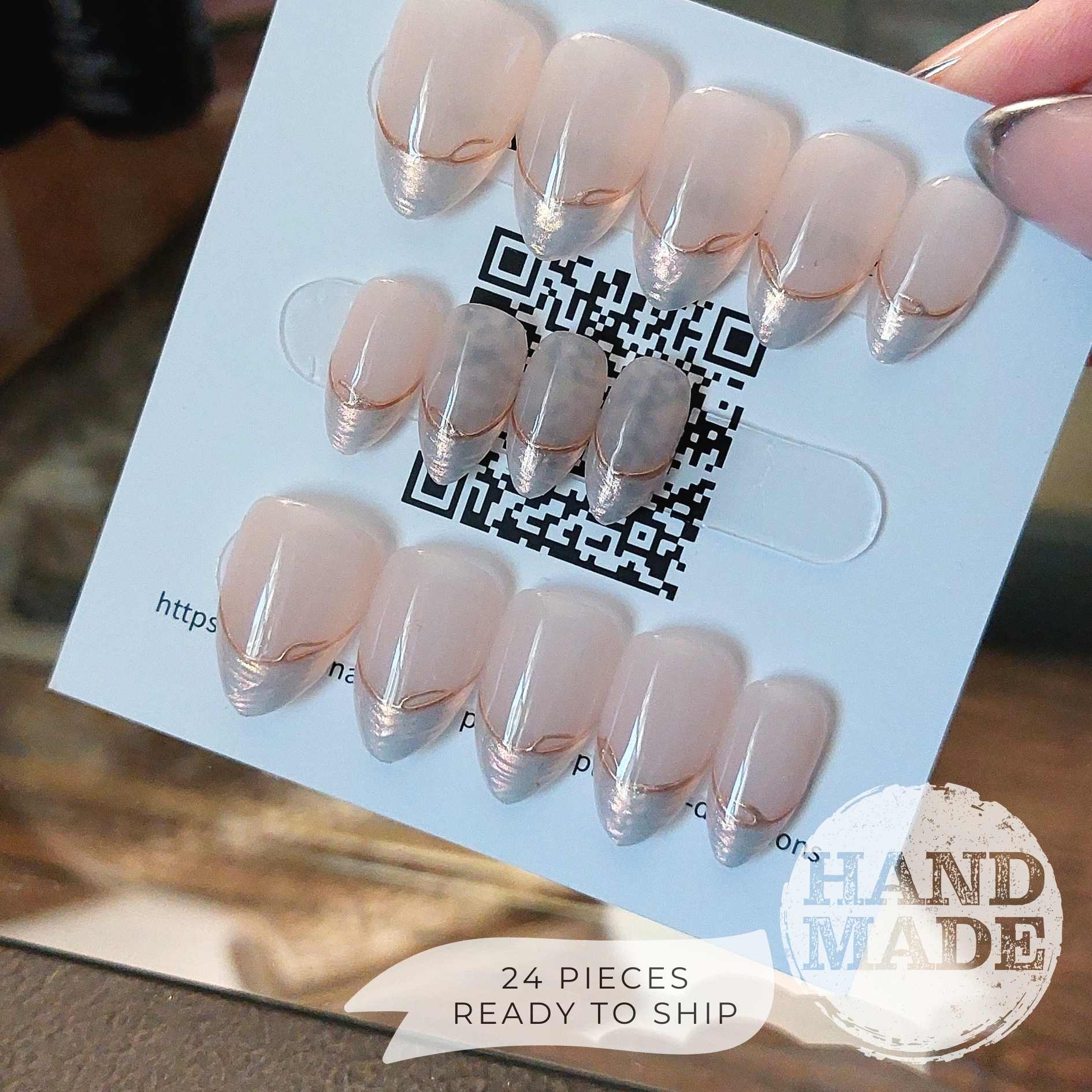 24 piece press on nail set, backside. Pearlescent French Tip Press on Nails with Gold Line on Nude base color, short almond. Handmade press on nails from FancyB Nails.