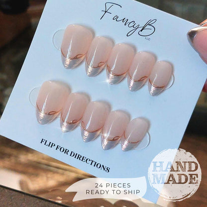 Pearlescent French Tip Press on Nails with Gold Line on Nude base color, short almond. Handmade press on nails from FancyB Nails.