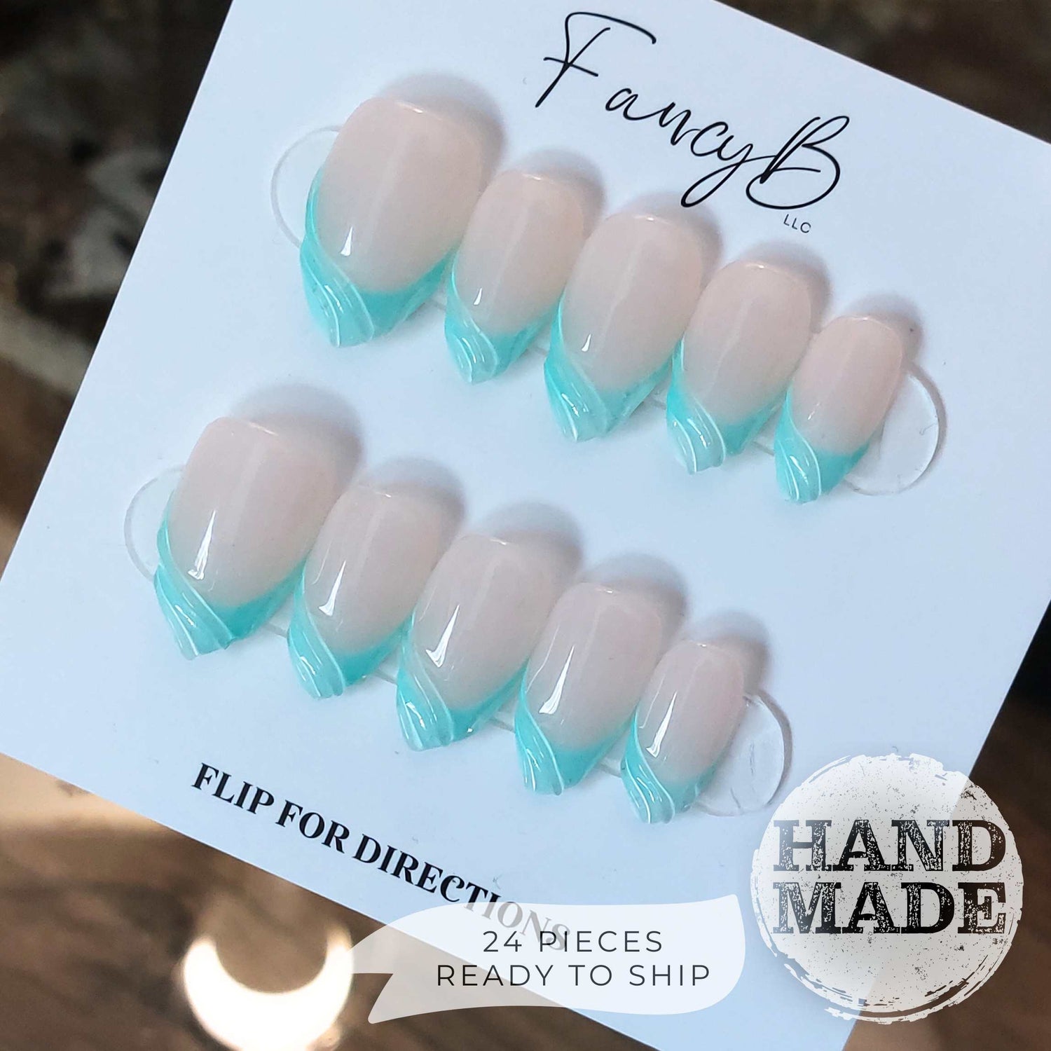 Cyan french tips with 3d swirls, bright mint blue french tip press on nails. Handmade reusable press on nails from FancyB Nails show in short almond.