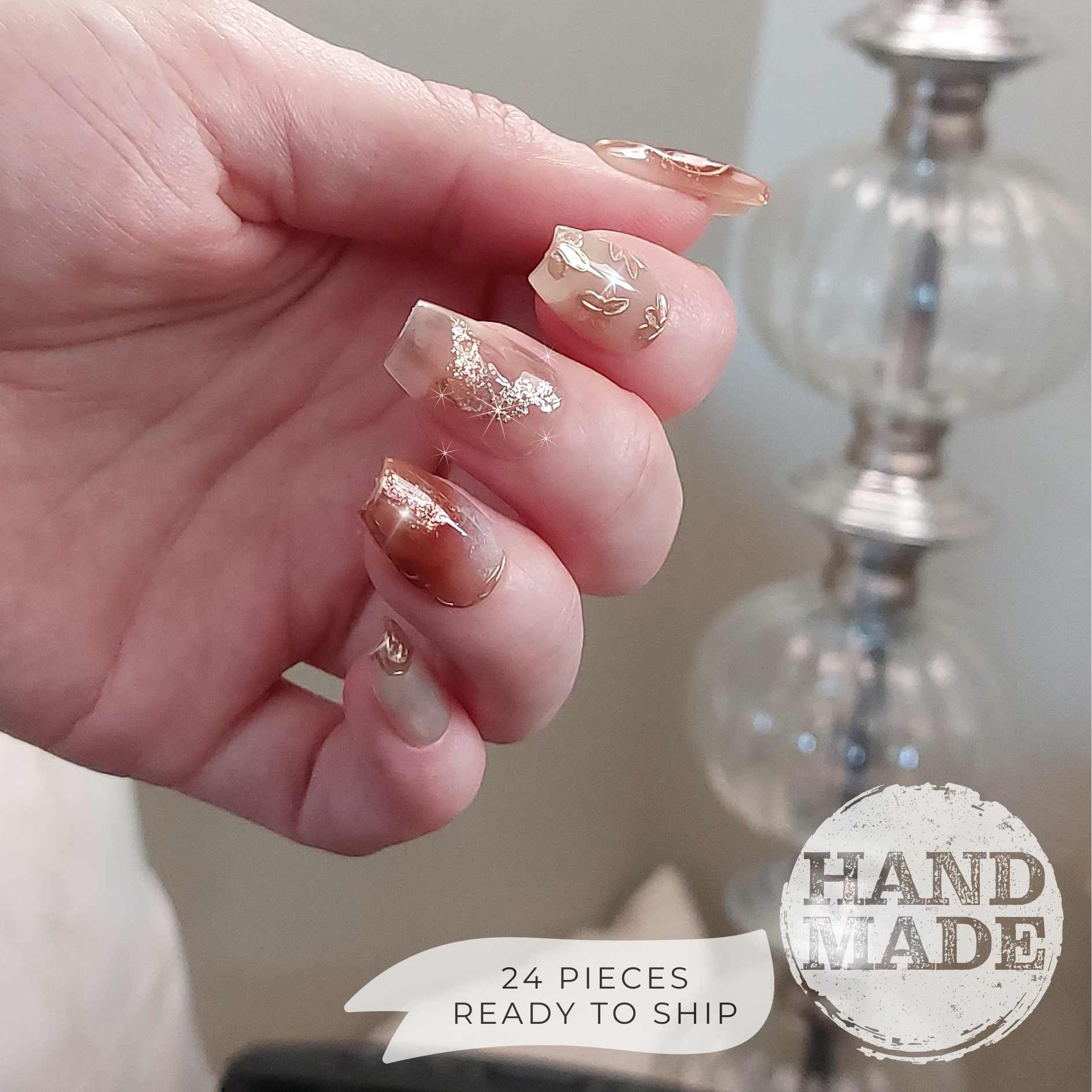 Fancy Floral press on nails, flower press on nails with gold and champagne flowers, pink merlot marble designs with glitter and champagne accents. Handmade reusable press on nails from FancyB Nails in short coffin.