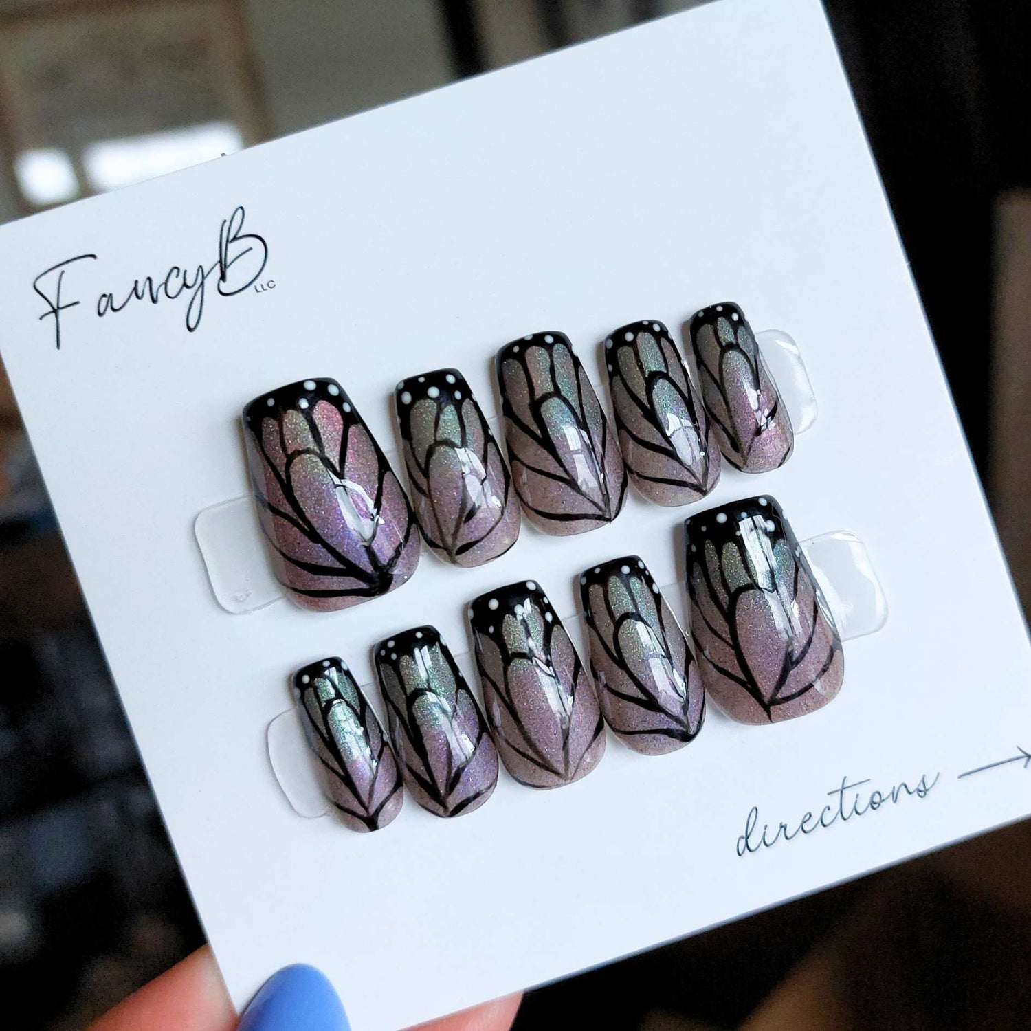 custom monarch butterfly nails, butterfly press on nails with hand painted details, purple to green ombre on short coffin nails from fancyb nails