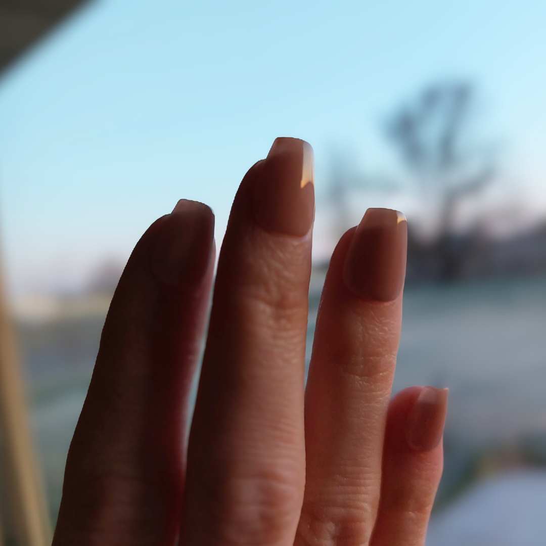 Jelly nude nails in extra short coffin shape, perfectly natural nude color with a milky texture finish from fancyb nails.