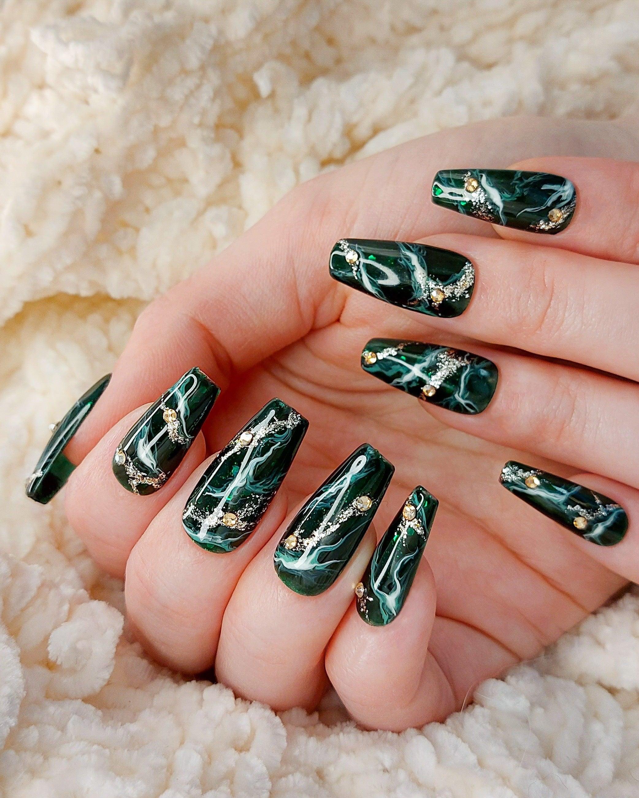 Green Marble Queen, Deep Emerald Green Press on nails with Marble Designs and Glitter, shown in medium coffin shape. Durable and reusable press on nails.