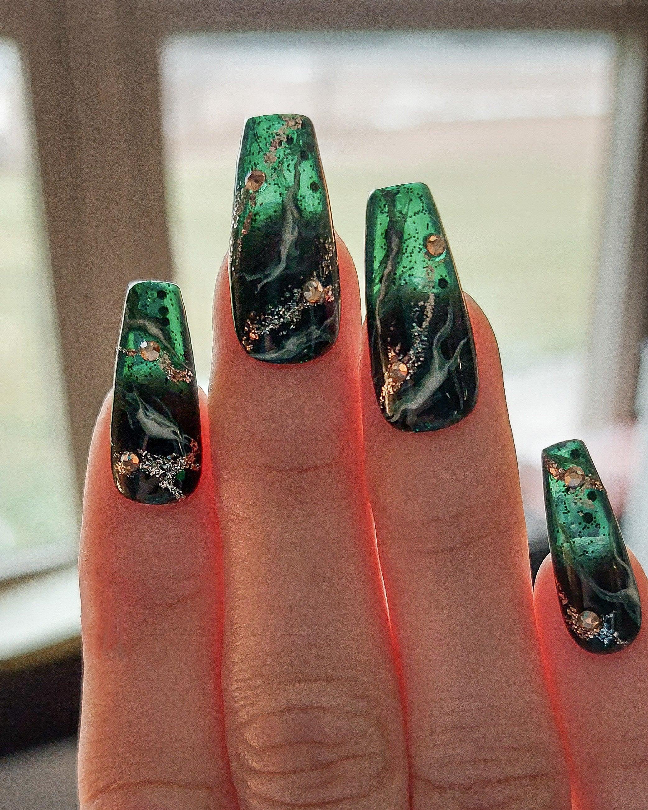 Green Marble Queen, Deep Emerald Green Press on nails with Marble Designs and Glitter, shown in medium coffin shape. Durable and reusable press on nails.