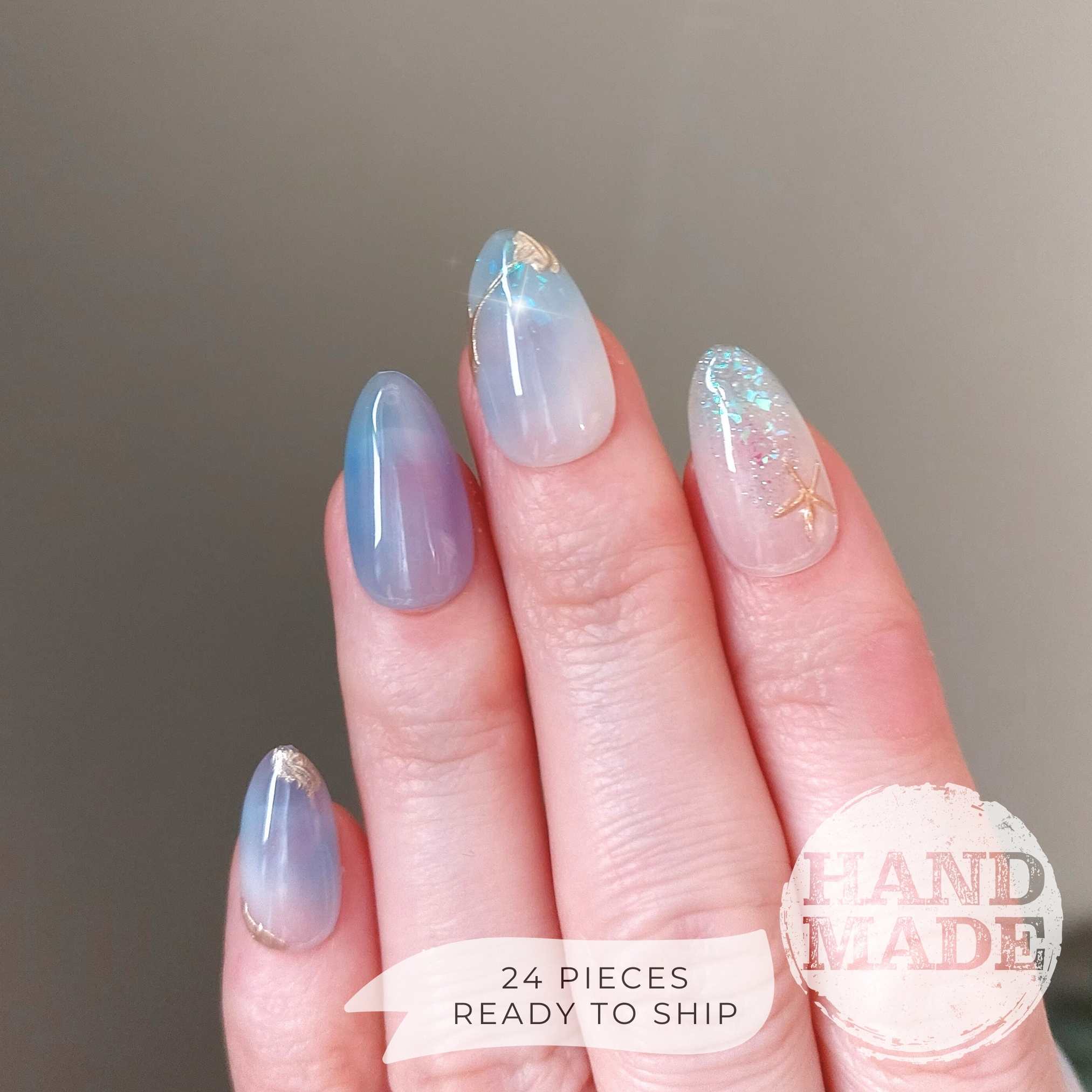 Sea glass ocean nails with starfish, handmade ocean mermaid theme nails from fancyb nails. Short almond press on nails.