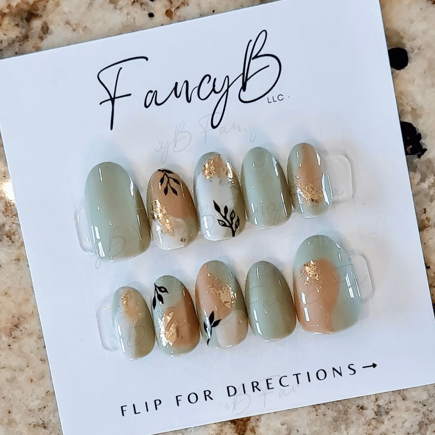Custom press on nail set, boho leaves and gold flakes with sage and clay colors. FancyB Nails
