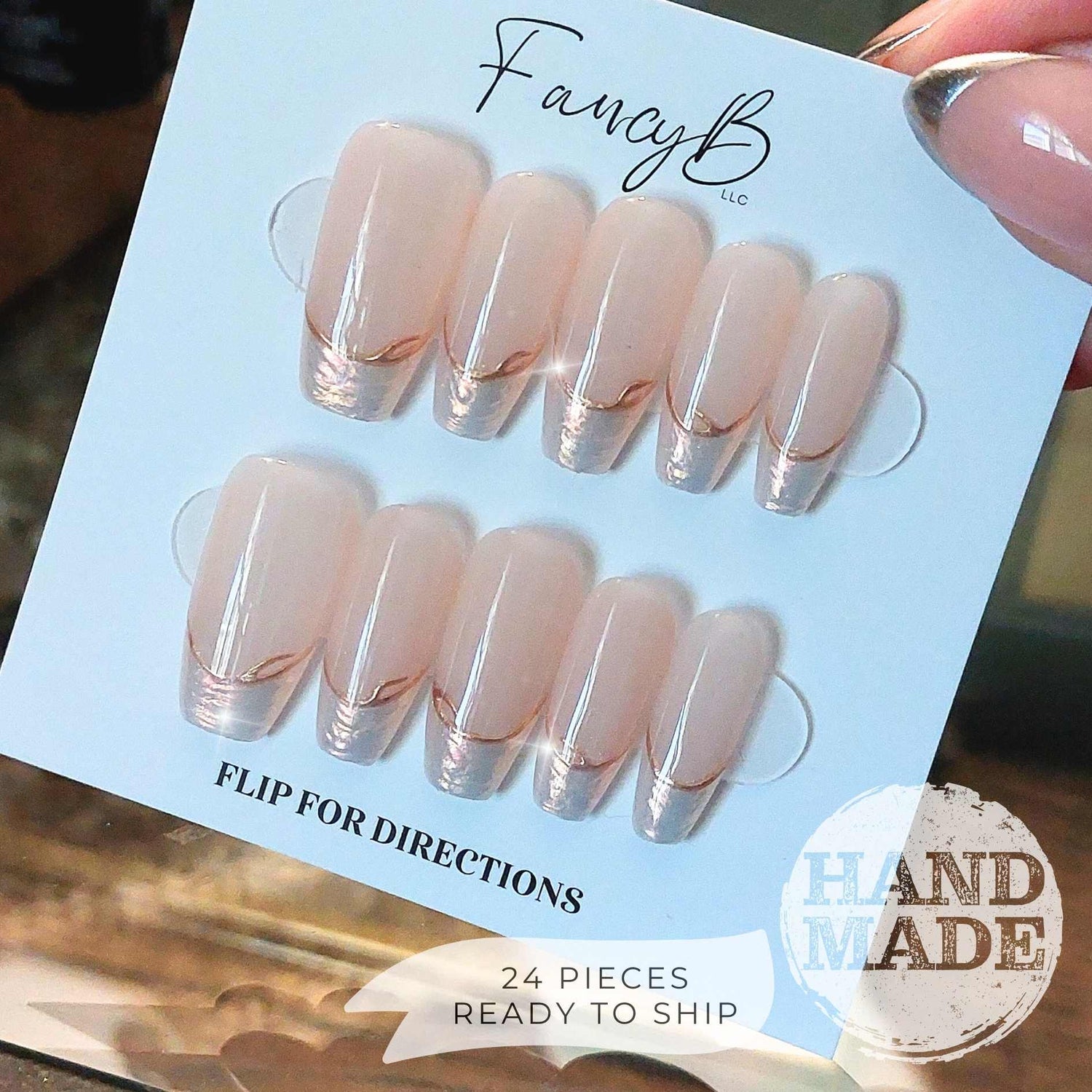 Pearlescent French Tip Press on Nails with Gold Line on Nude base color, medium coffin. Handmade press on nails from FancyB Nails.