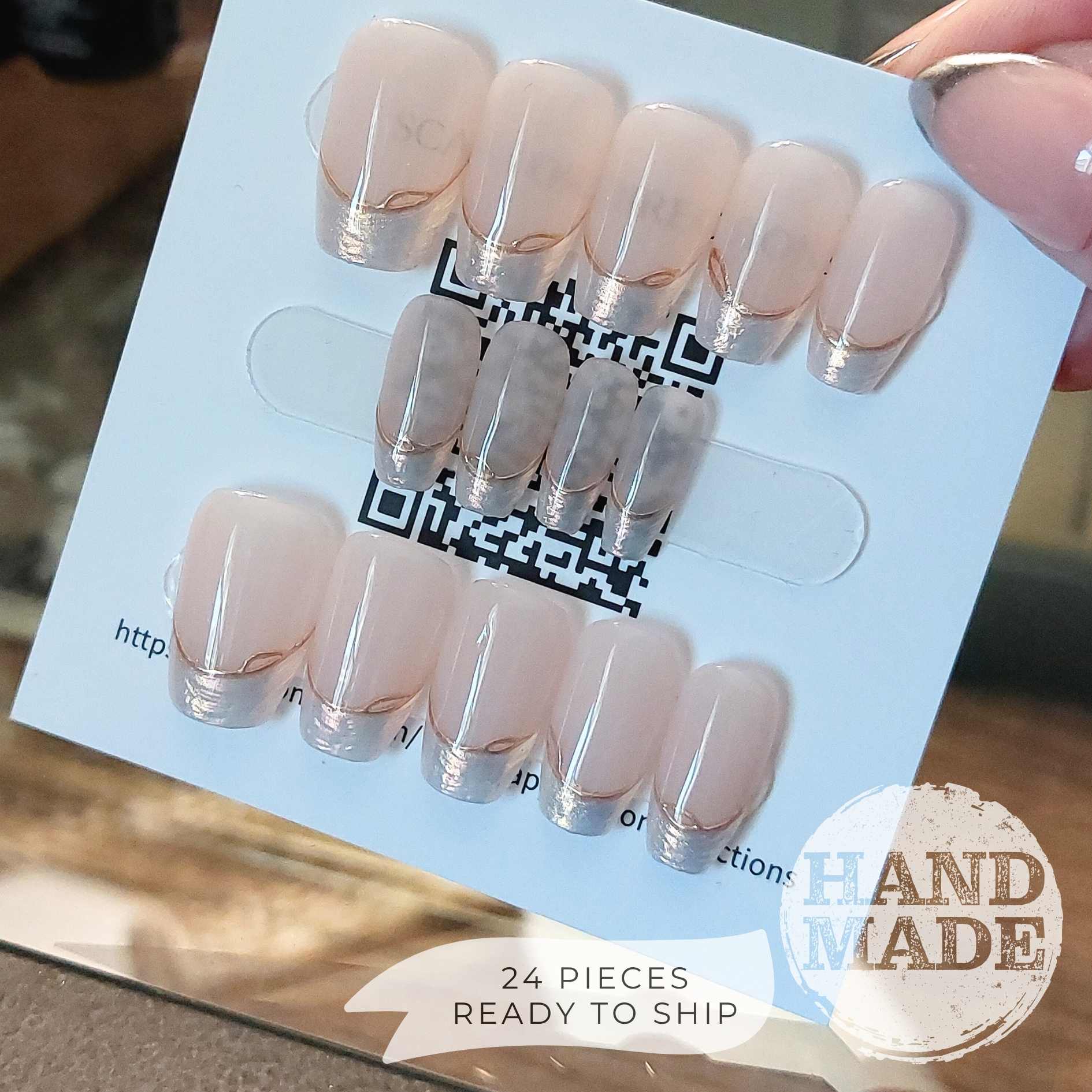 24 piece press on nail set, backside. Pearlescent French Tip Press on Nails with Gold Line on Nude base color, short coffin. Handmade press on nails from FancyB Nails.