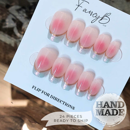 Blush jelly nails, blush press on nails with pink center and nude base gel, gold chrome french lines and pearl french tips, reusable nails. FancyB press on nails shown in short coffin.