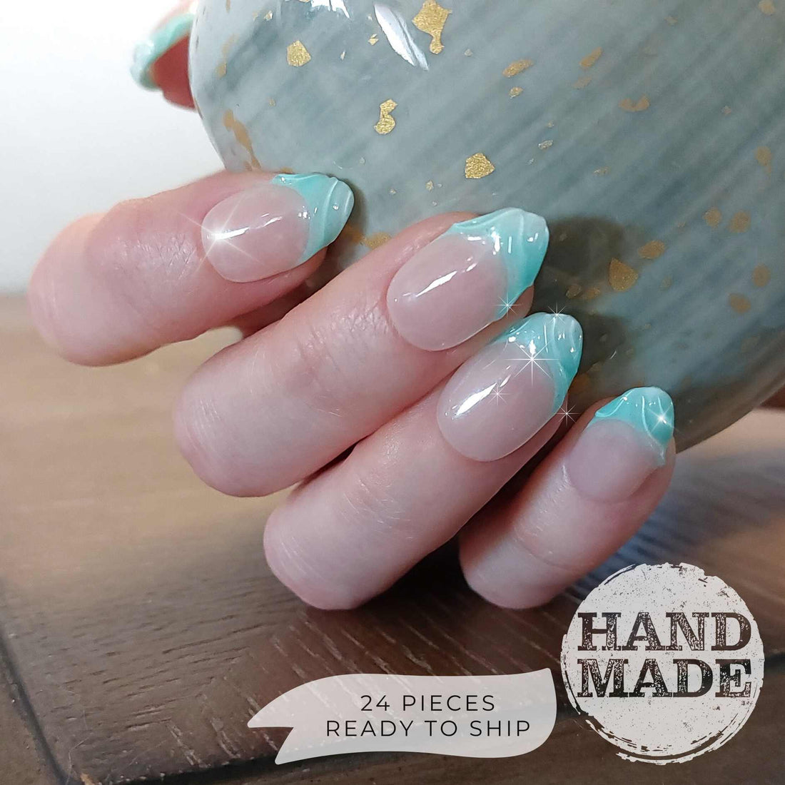Cyan french tips with 3d swirls, bright mint blue french tip press on nails. Handmade reusable press on nails from FancyB Nails show in short almond.