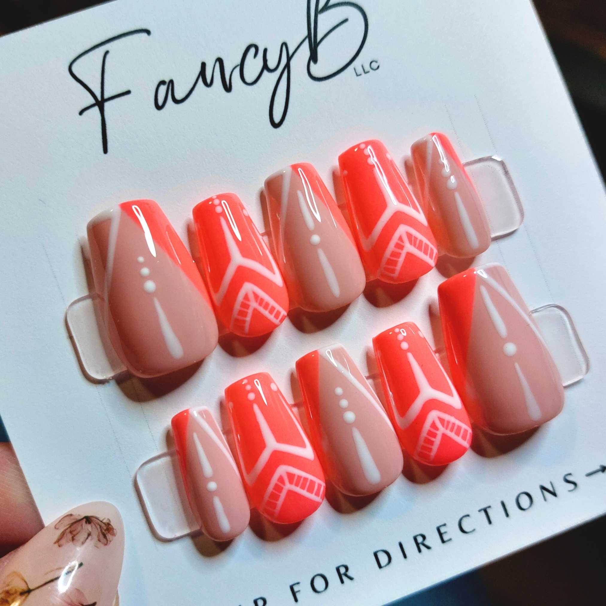 Neon coral tribal nails, fancyb custom press on nails with neon pink coral, nude french nails and tribal nails with dots and line designs, short coffin nails.