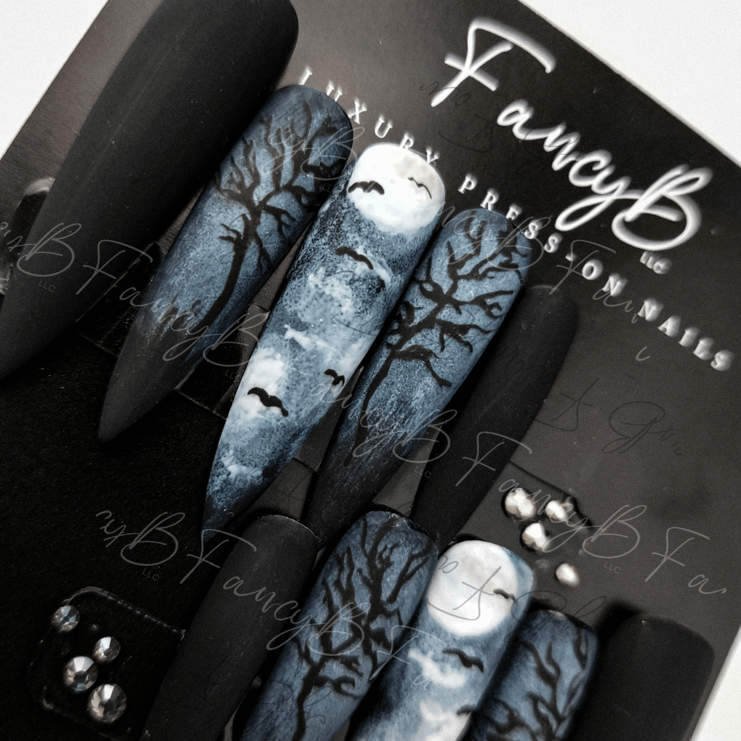 custom halloween press nails with bats, moon, creepy fog and trees. Spooky season nails by FancyB Nails.