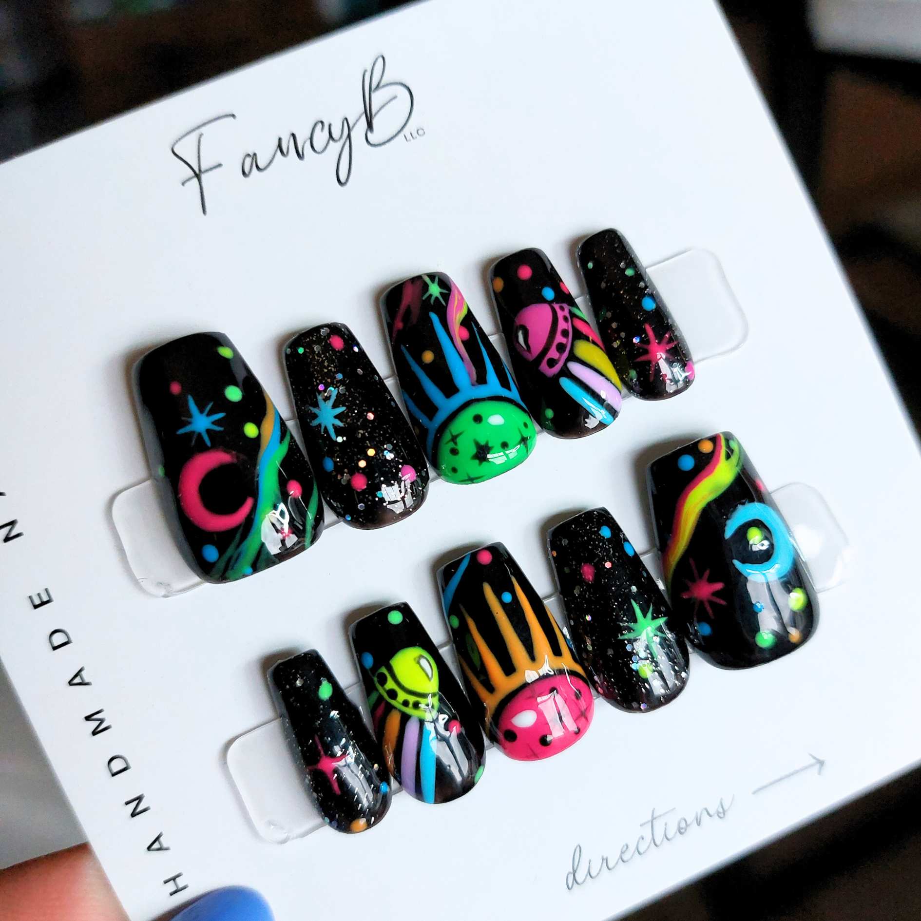 custom psychedelic nails, trippy space theme with UFOs, moons, stars, saucers, and colorful designs on short coffin nails from fancyb handmade nails.