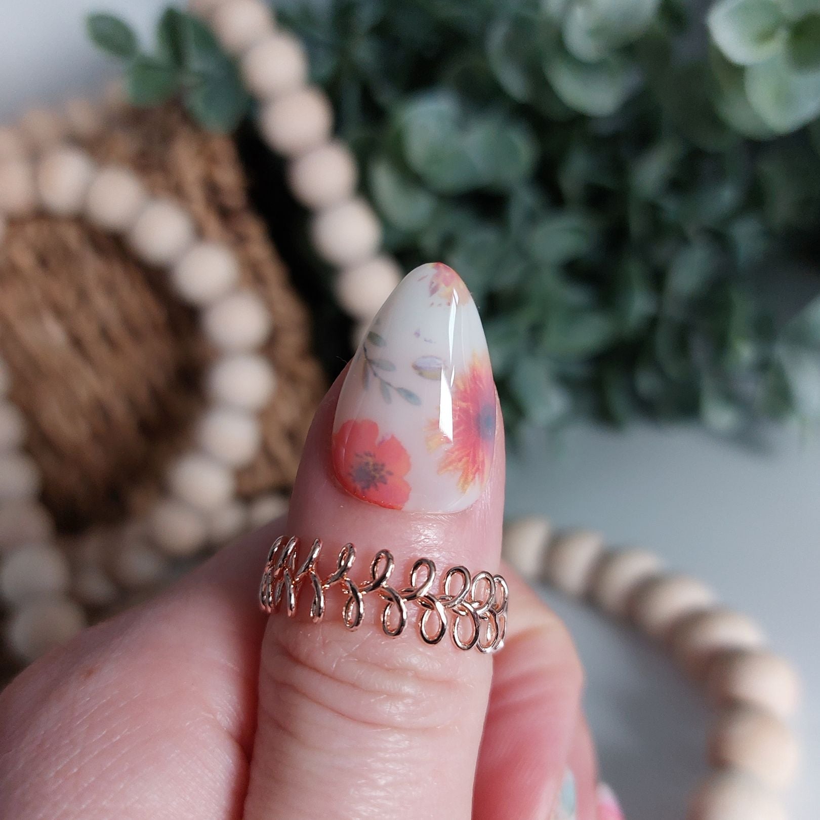 milk bath nails thumb nail with orange flowers and milky white color