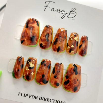 tortoiseshell press on nails with lime green outline and gold flakes
