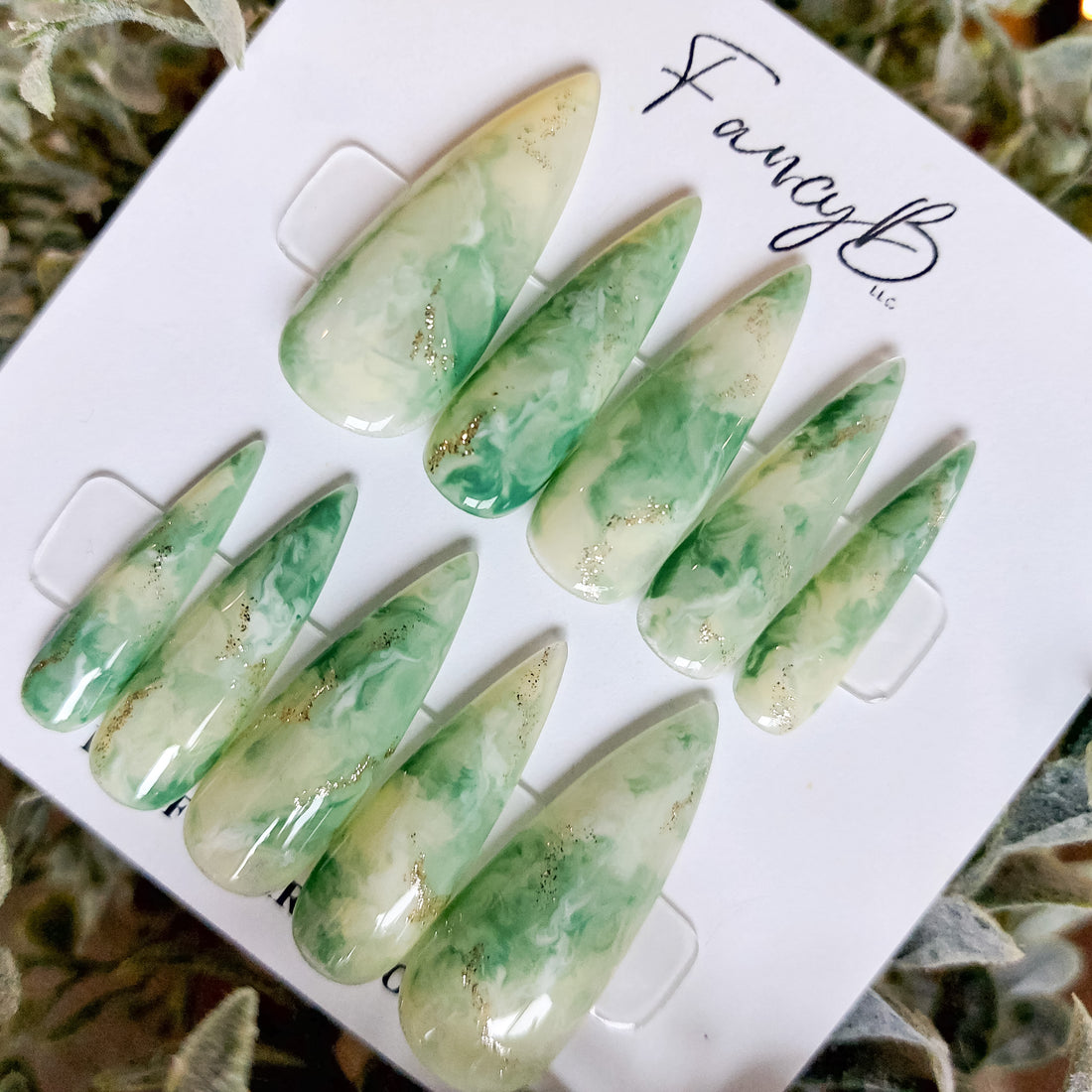 Jade stone press on nails perfect for spring, light green marble designs and gold glitter. Reusable press on nails, handmade marble press ons. St. Patrick&