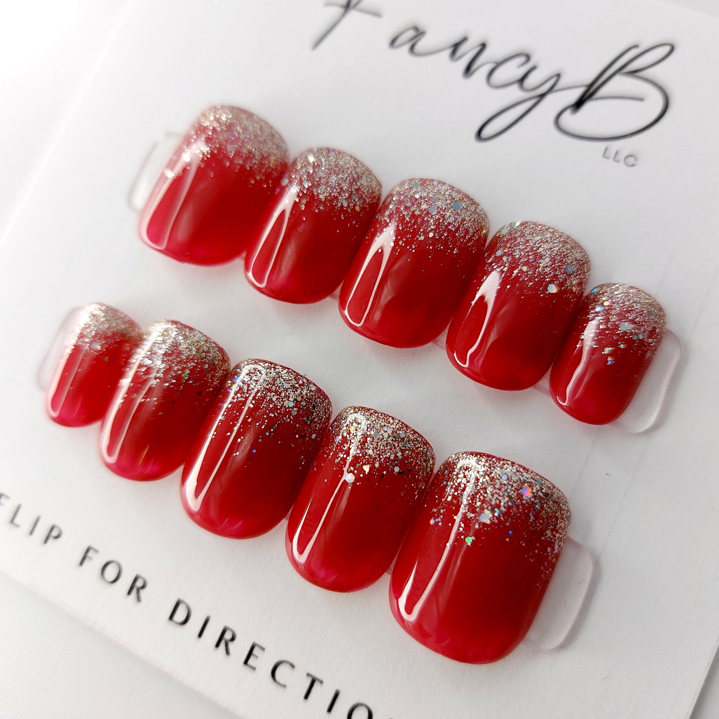 Ruby Glitter Tips with Silver Glitter on Short Squoval Press on Nails. Handmade, resuable press ons. Fancyb nails.