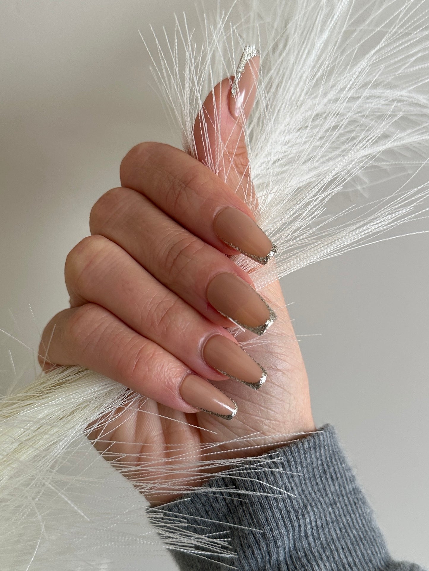 skinny french tips with silver glitter tips on a short coffin nail shape. beauty by hannalee press on nails.