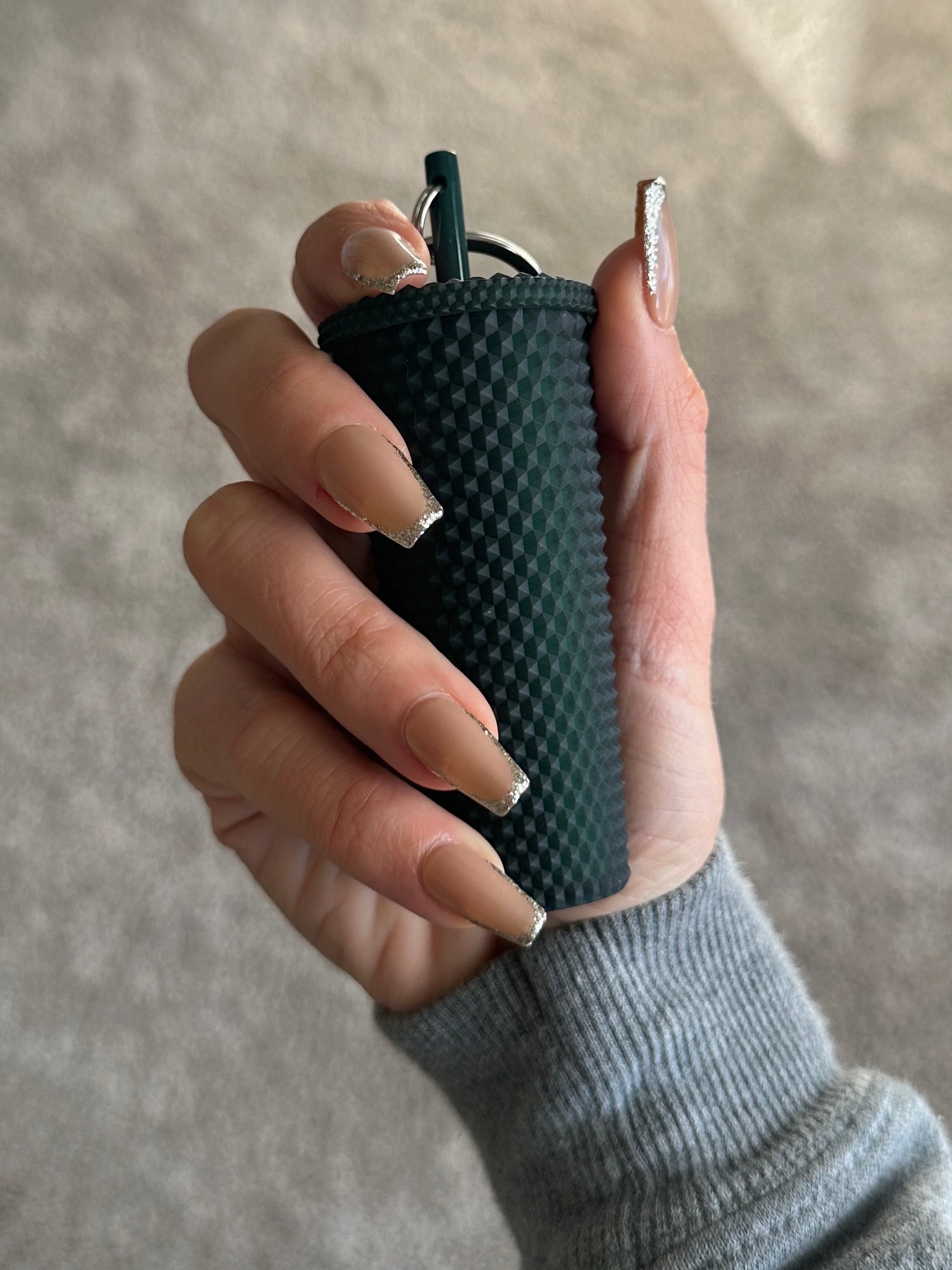 skinny french tips with silver glitter tips on a short coffin nail shape. beauty by hannalee press on nails.