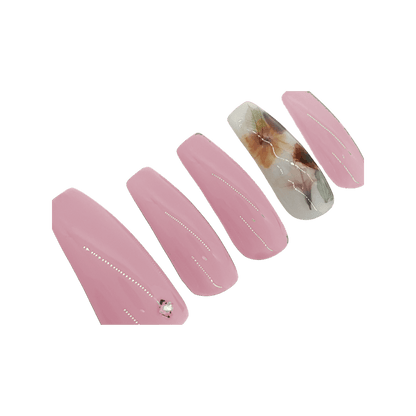 Blush pink milk bath press on nails with a milky white accent nail with leaves and flowers. Shown in a long coffin/ballerina shape.