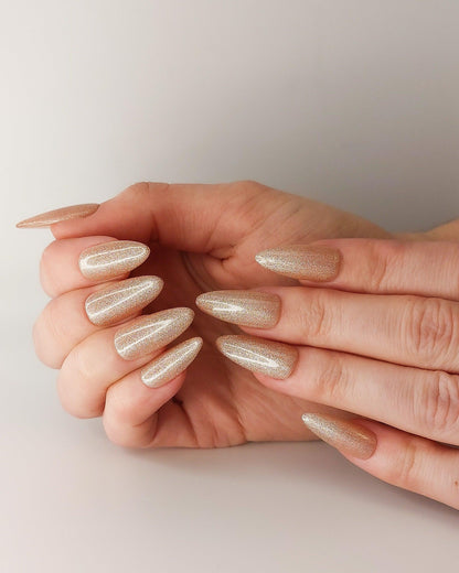 Reflective Champagne Sheer Glitter Press on Nails in a Soft Beige Pink.